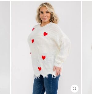 White Sweater with Red Heart Accents